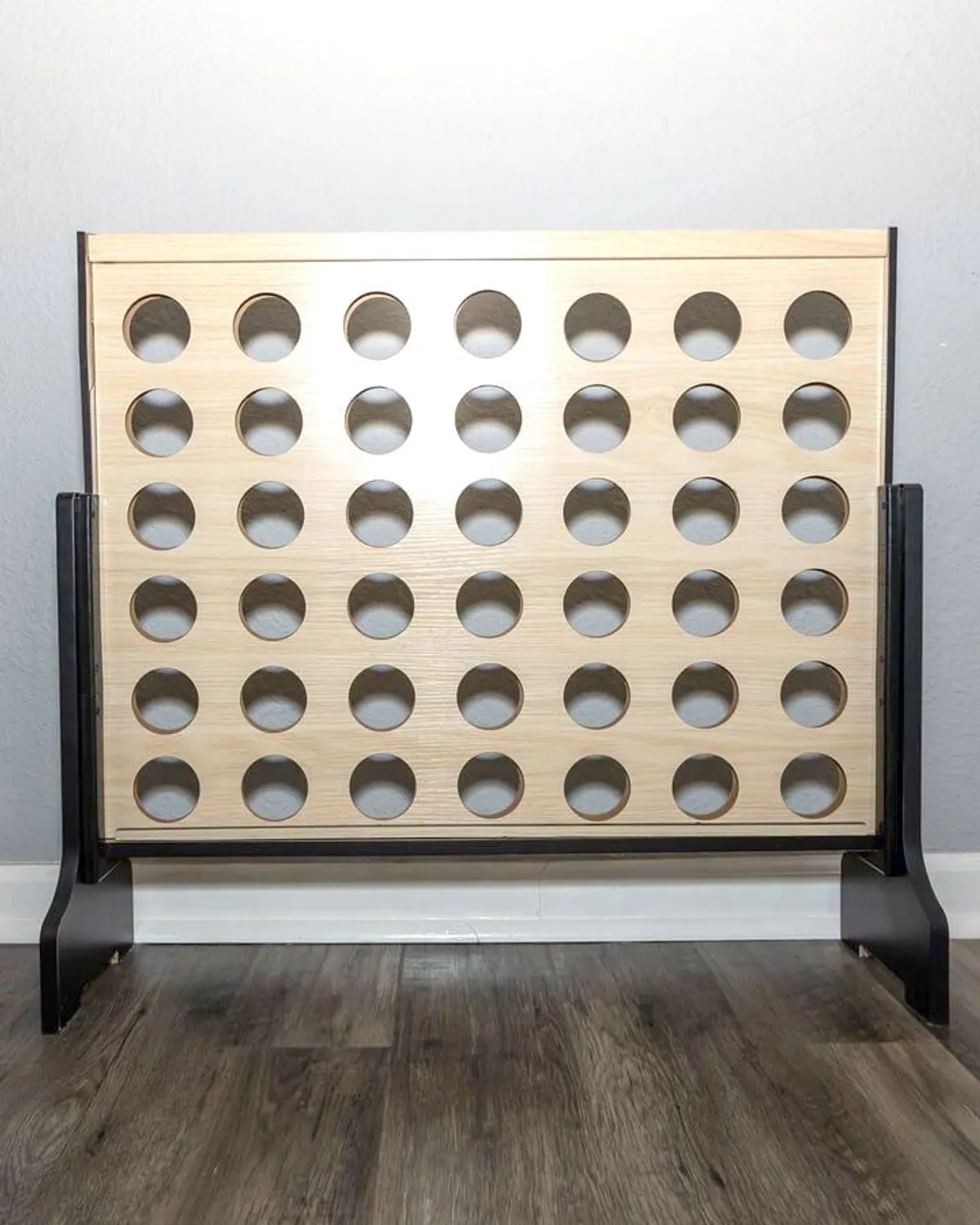A close-up of a Connect Four game board, ready for play. The vibrant pieces and inviting game setup evoke friendly competition and joyful moments shared between guests of all ages.